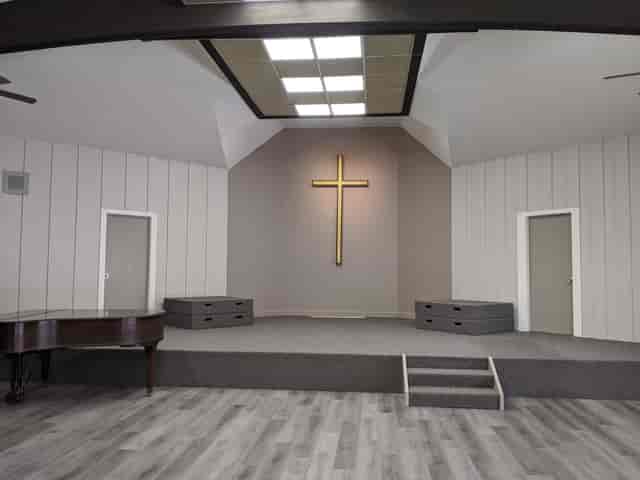 Courtyard at Prince of Peace Church with raised platform, ideal for events and gatherings.