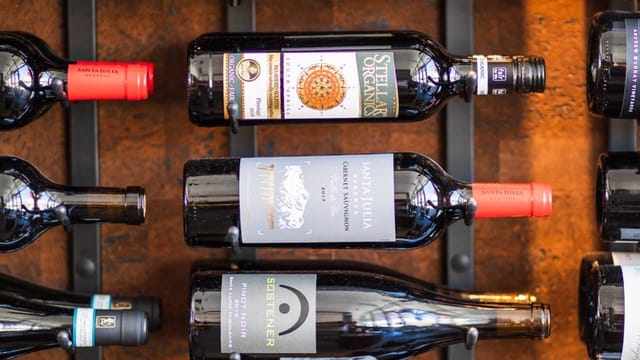 Cocktail bar with diverse wine selection for events and networking opportunities.