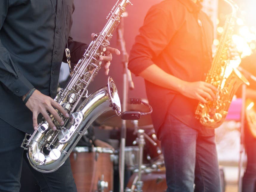 Musicians performing with saxophones at Oshman Family JCC for vibrant events.