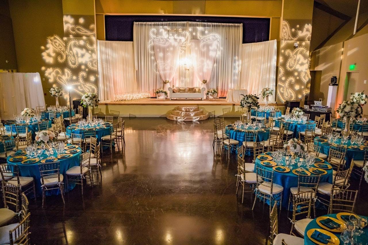 Albert and Janet Schultz Cultural Arts Hall with elegant tables, ideal for weddings and events.