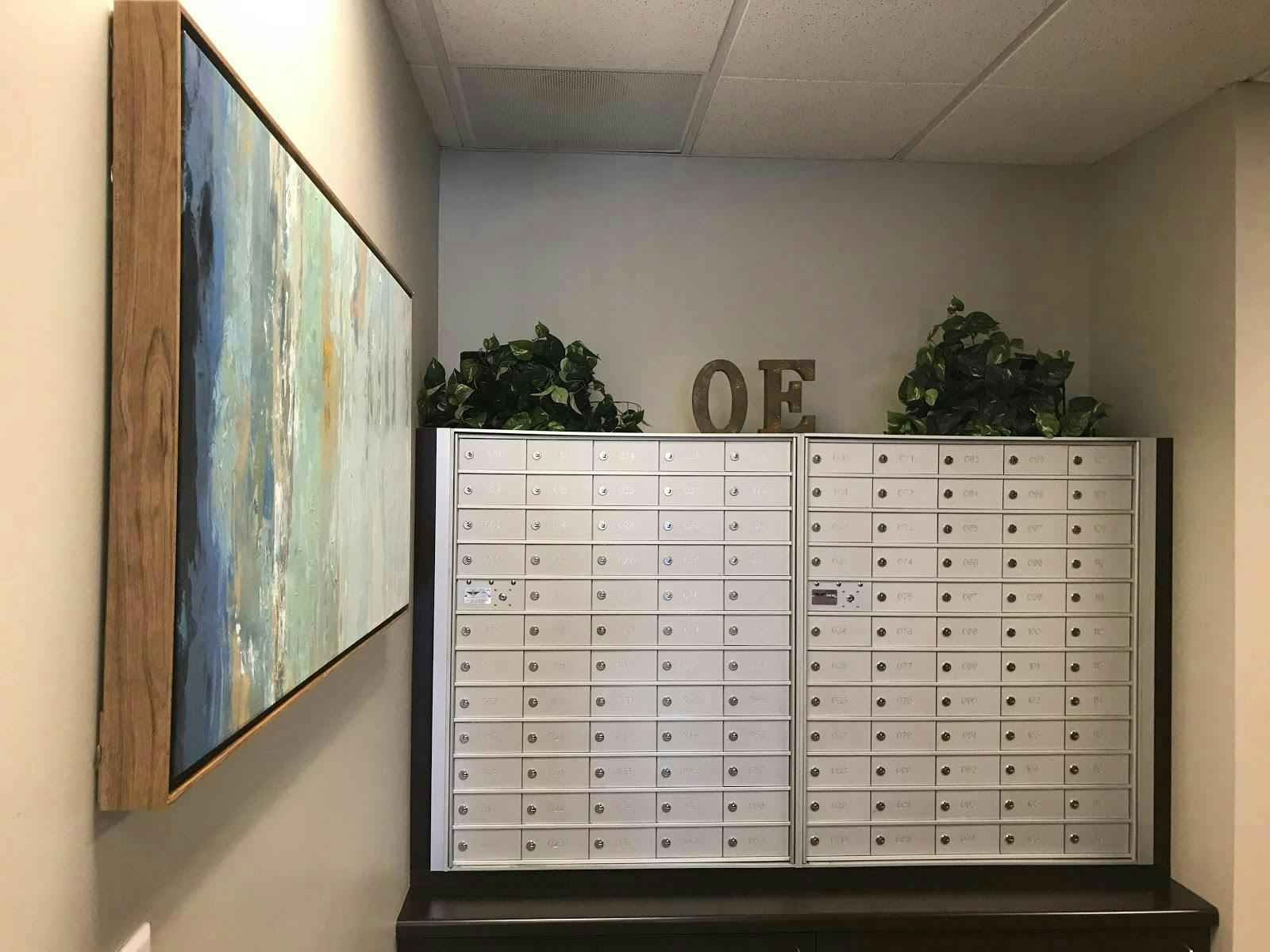 Small meeting room with modern design and organized mailroom for efficient events.