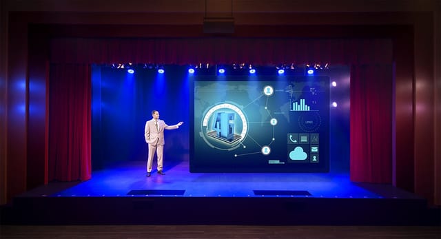 Professional speaker on stage at Starbright Theater with dynamic visuals for engaging events.