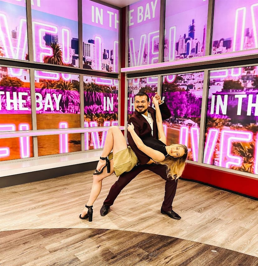"Vibrant San Jose Bachata Nights performance backdrop with urban skyline for engaging events."