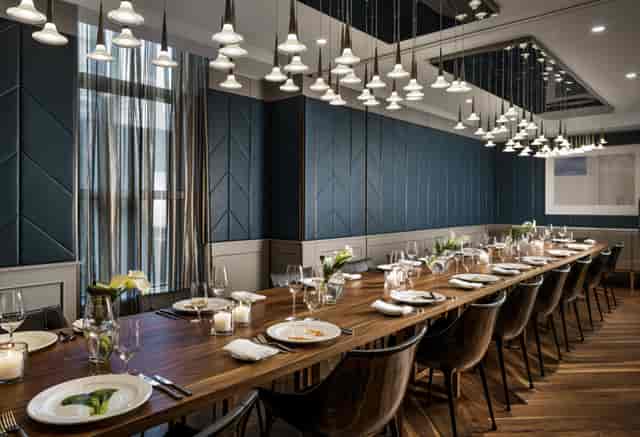 Elegant TOCA Private Dining Room with long table, ideal for corporate dinners and events.