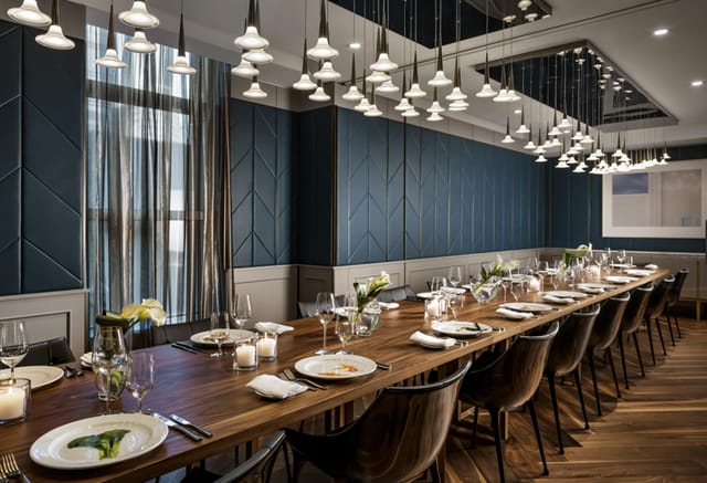 Elegant TOCA Private Dining Room with long table, ideal for corporate dinners and events.