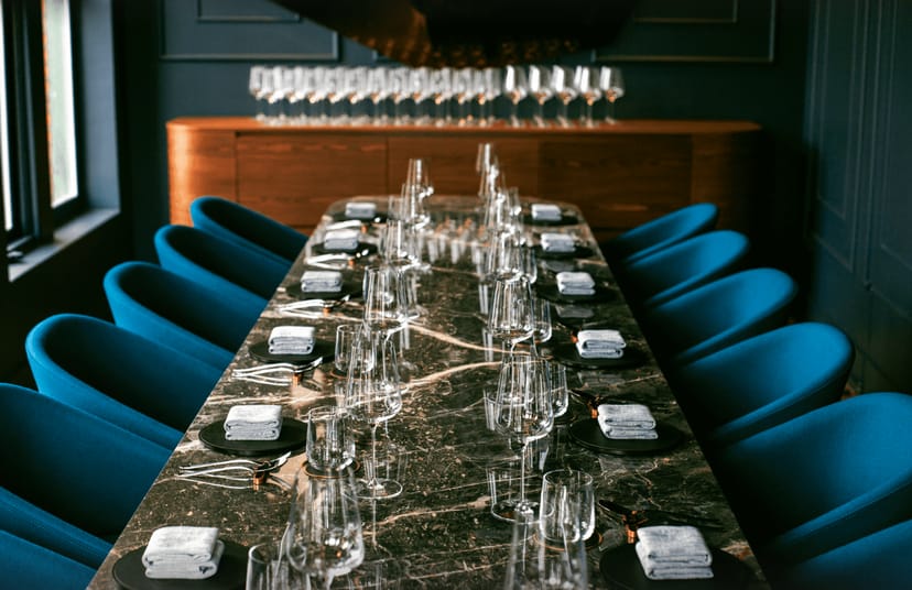 Private dining room at Alo Restaurant with elegant marble table for corporate events.