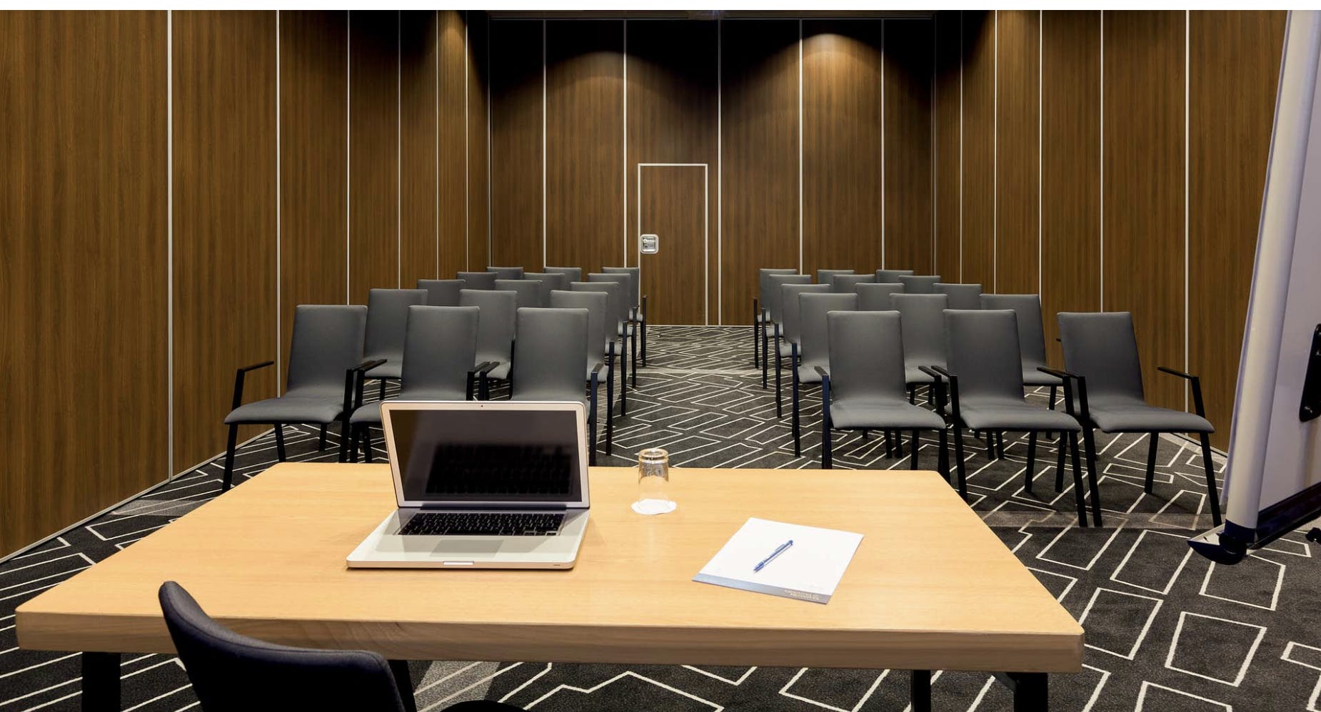 Meeting room at Novotel Amsterdam City, sleek setup for professional presentations and workshops.