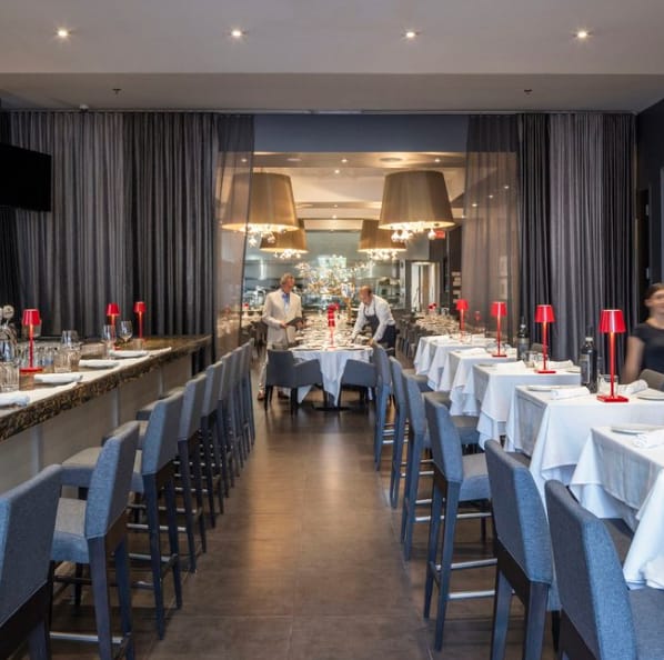 Private dining room in Modus with elegant table settings for corporate events.