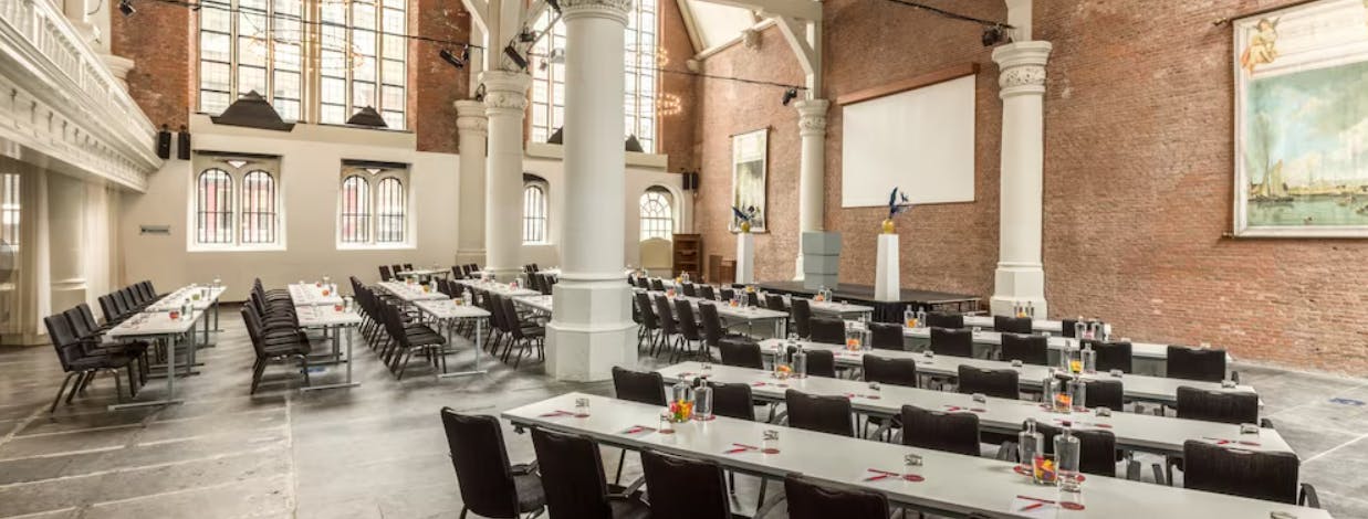 Spacious St Olof's venue with tables for conferences and meetings at NH Collection Barbizon Palace.
