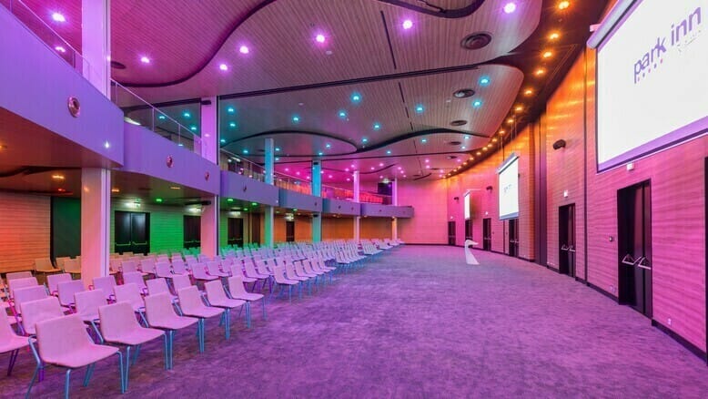 Pearl Ballroom at Park Inn Amsterdam, modern event space with dual screens for conferences.