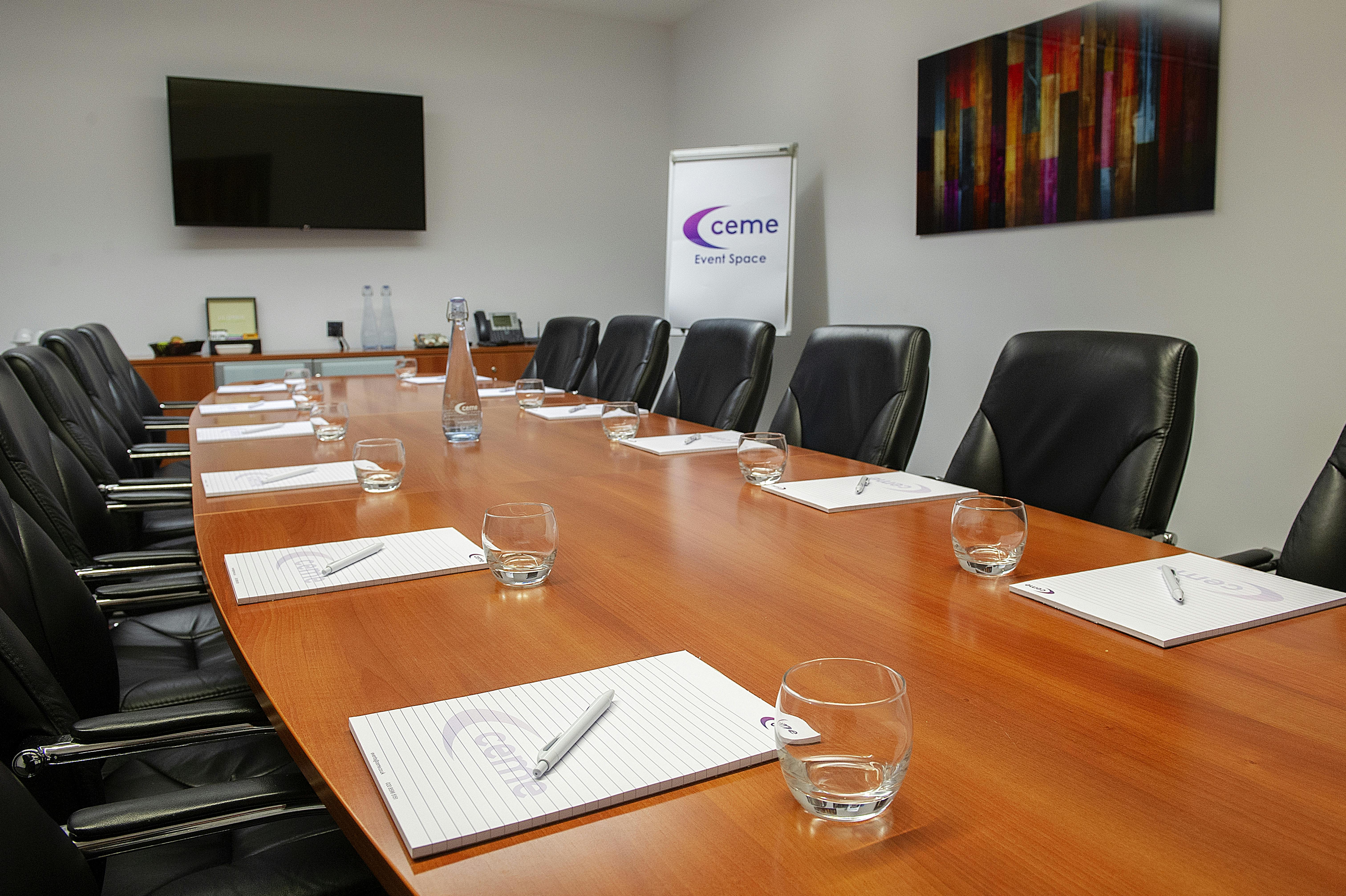 Medium Boardroom at CEME Events Space with long table, ideal for meetings and presentations.