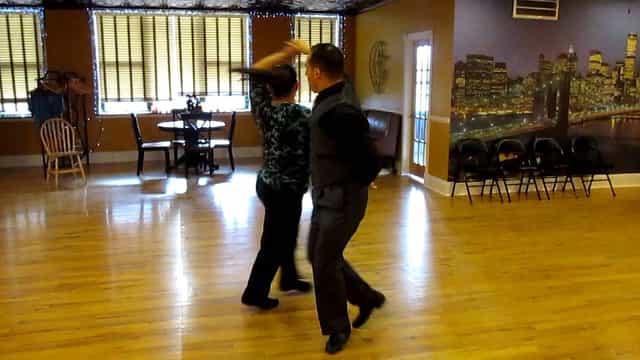 Wedding choreography lesson in spacious Dance Fever Studios with warm lighting.