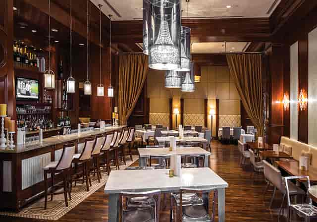 Elegant Grant Grill Lounge with warm lighting, ideal for corporate dinners and private events.