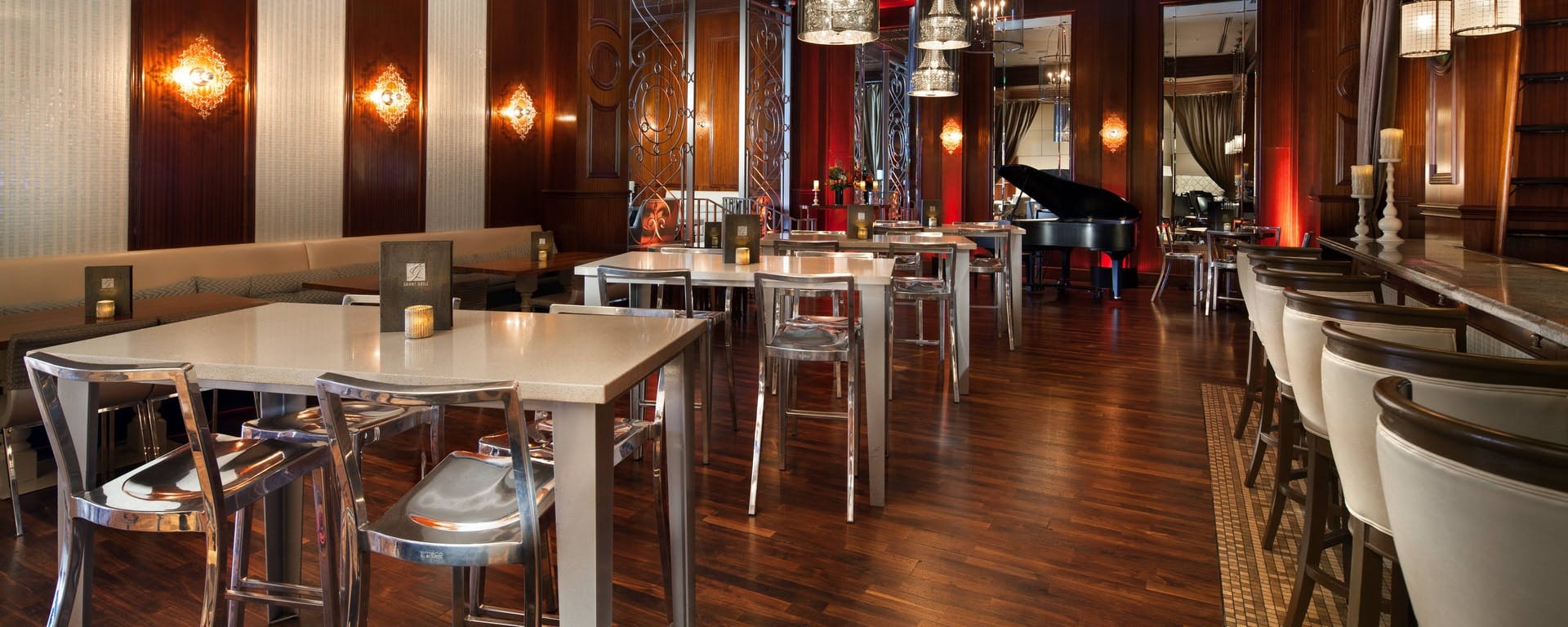 Grant Grill Lounge with modern decor, grand piano, ideal for networking events and private dinners.