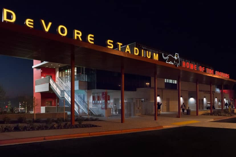 DeVore Stadium at Southwestern College, modern venue for events with vibrant nighttime lighting.