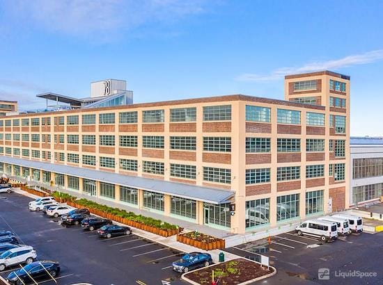 Modern meeting room with large windows, perfect for conferences and workshops.