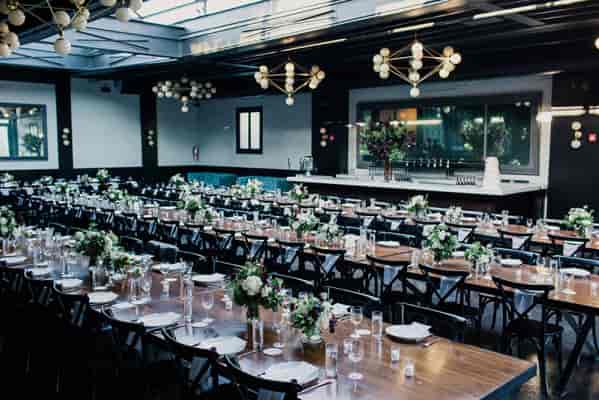 Elegant event space at 501 Union with floral centerpieces, ideal for weddings and banquets.