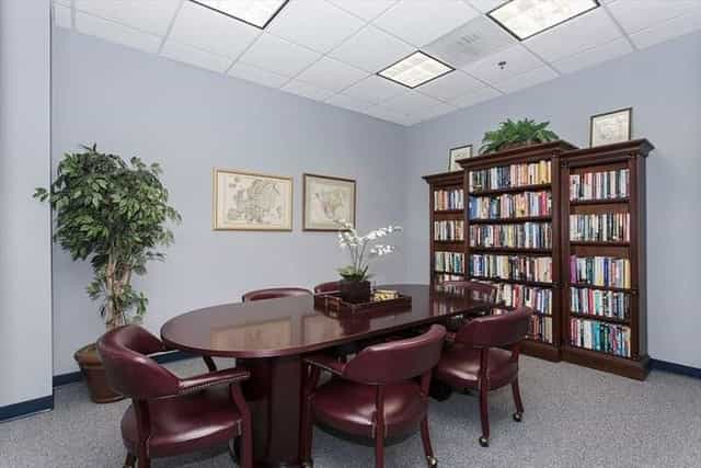 Meeting room with round table and chairs for collaborative brainstorming sessions.