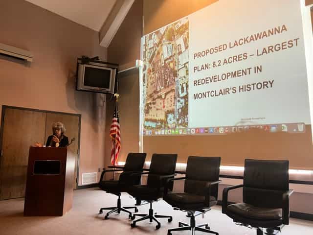 Professional meeting room with speaker presenting Lackawanna redevelopment plan in Montclair.