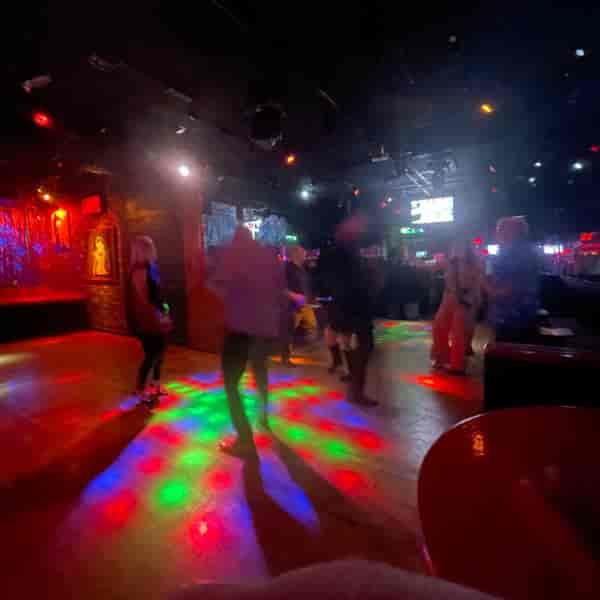 Vibrant B66 Club seating area with dynamic lighting for social gatherings and parties.