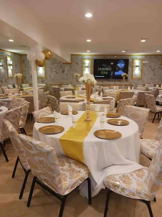 Elegant event space with gold decor, perfect for formal gatherings and celebrations.