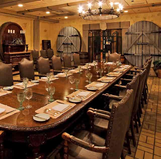 Elegant long dining table in upscale private event space at The Highlawn.