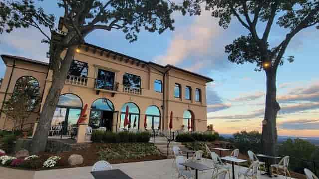Elegant private event space with large windows and scenic views at The Highlawn.