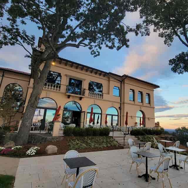 Elegant Highlawn patio venue with large windows for meetings and receptions.
