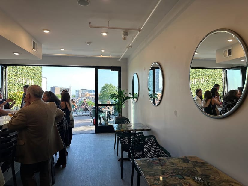 Sophia Rooftop event space with large windows, ideal for gatherings and meetings.