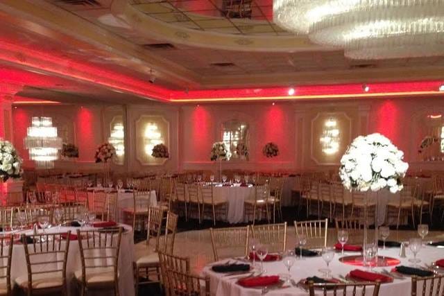 Elegant wedding hall with gold chiavari chairs and floral centerpieces in Richfield Regency.