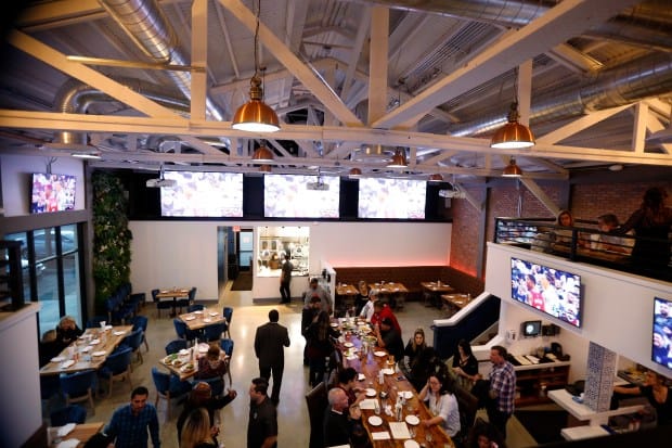 Vibrant Water Tower Kitchen bar with high ceilings, perfect for networking events.