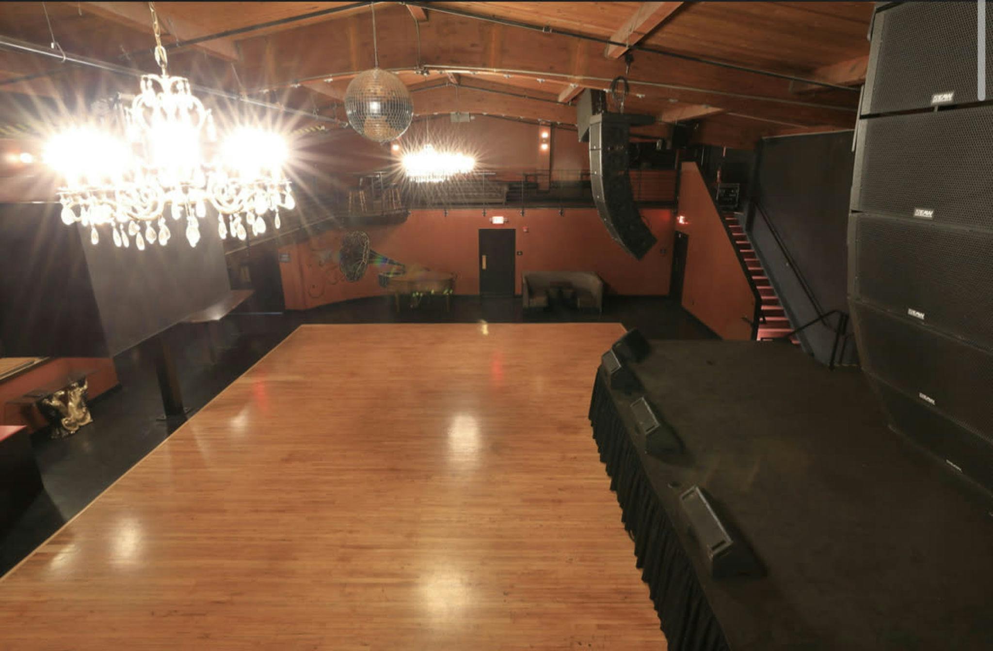Spacious Roof Deck at Continental Club with polished wooden dance floor for events.