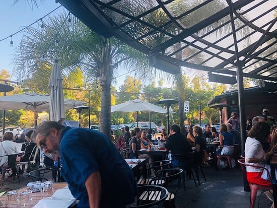 Outdoor Tequila Bar at Milagros: vibrant event space with seating for social gatherings.