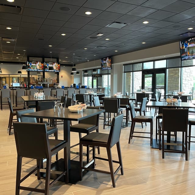 Modern event space at The Hill Tavern with natural light, ideal for meetings and receptions.