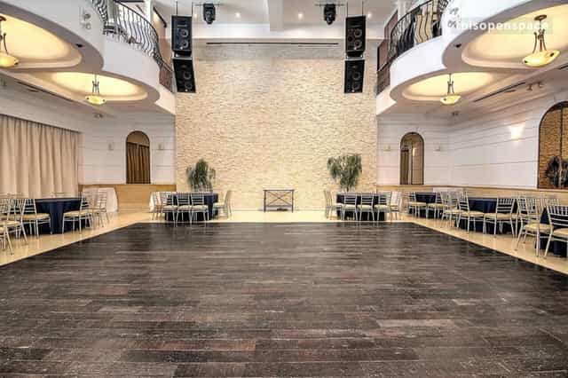 Spacious Renaissance Event Hall balcony with polished wood floor, ideal for gatherings.