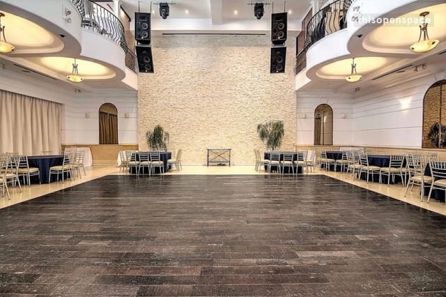 Spacious Renaissance Event Hall balcony with polished wood floor, ideal for gatherings.