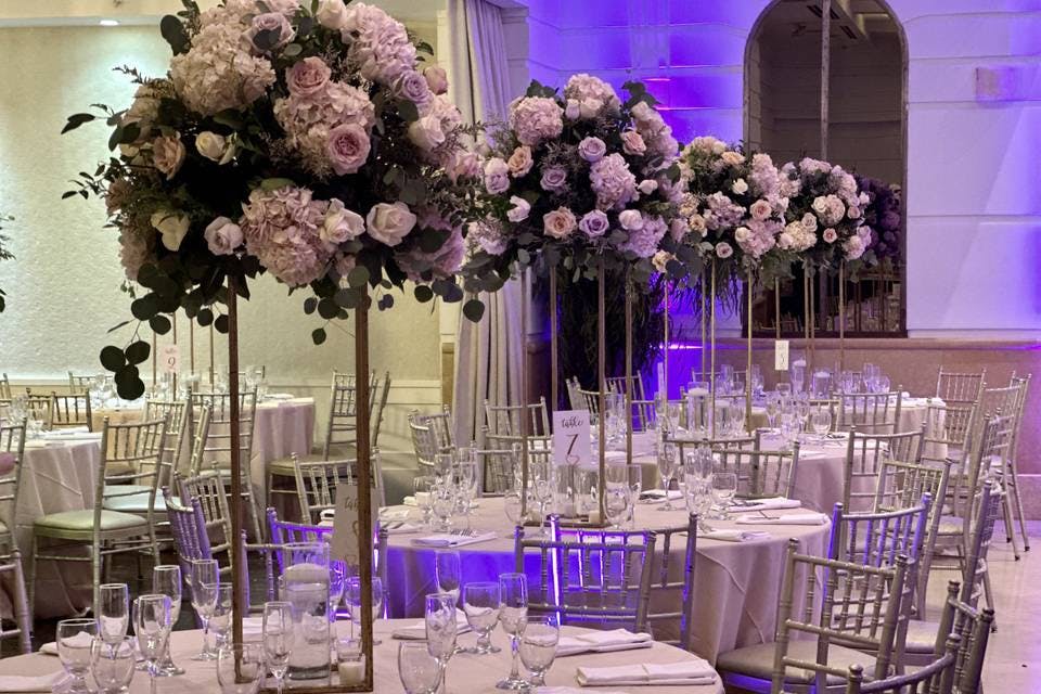 Elegant Main Reception Hall with round tables and floral centerpieces for weddings.