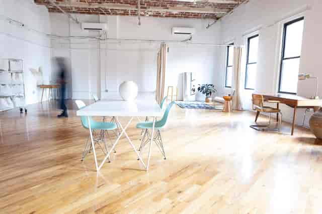 Spacious Dumbo Loft event space with wooden floors, ideal for meetings and workshops.