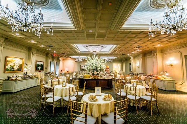 Elegant event space with round tables, ideal for weddings and corporate events.