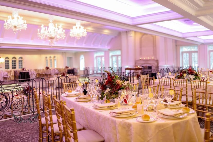 Elegant banquet hall with gold chiavari chairs, ideal for weddings and corporate events.