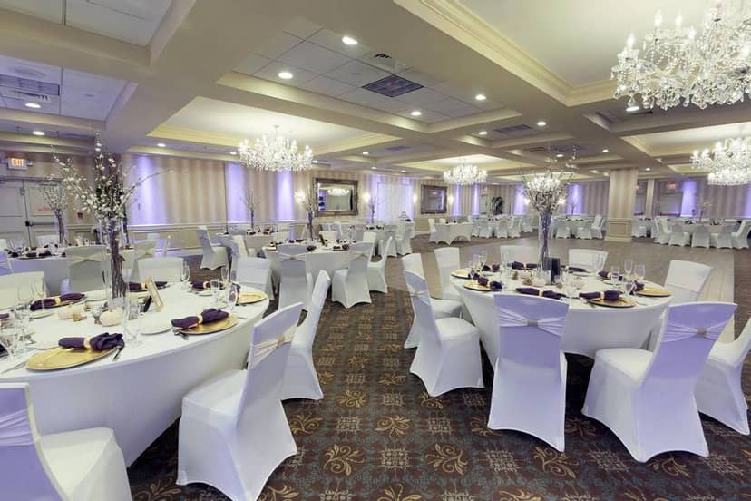Elegant ballroom with round tables, perfect for weddings and formal events.