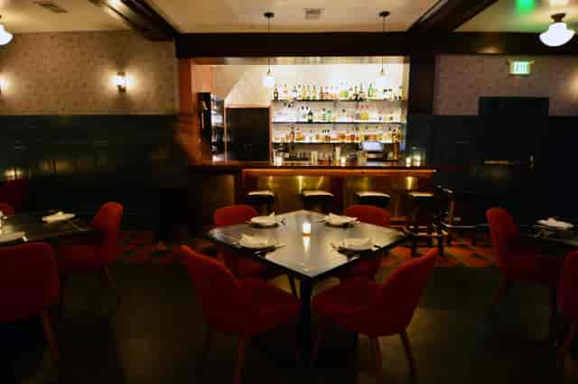 Cafe Du Nord: stylish restaurant with warm lighting, perfect for intimate gatherings and events.