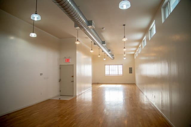 Versatile Greenpoint Hall event space with natural light, ideal for meetings and workshops.