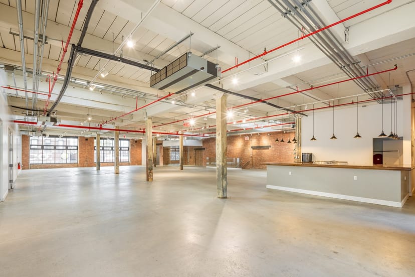 Spacious Greenpoint Hall event venue with industrial design, perfect for creative gatherings.