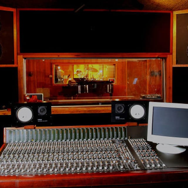 Professional recording studio with soundboard, ideal for music events and workshops.