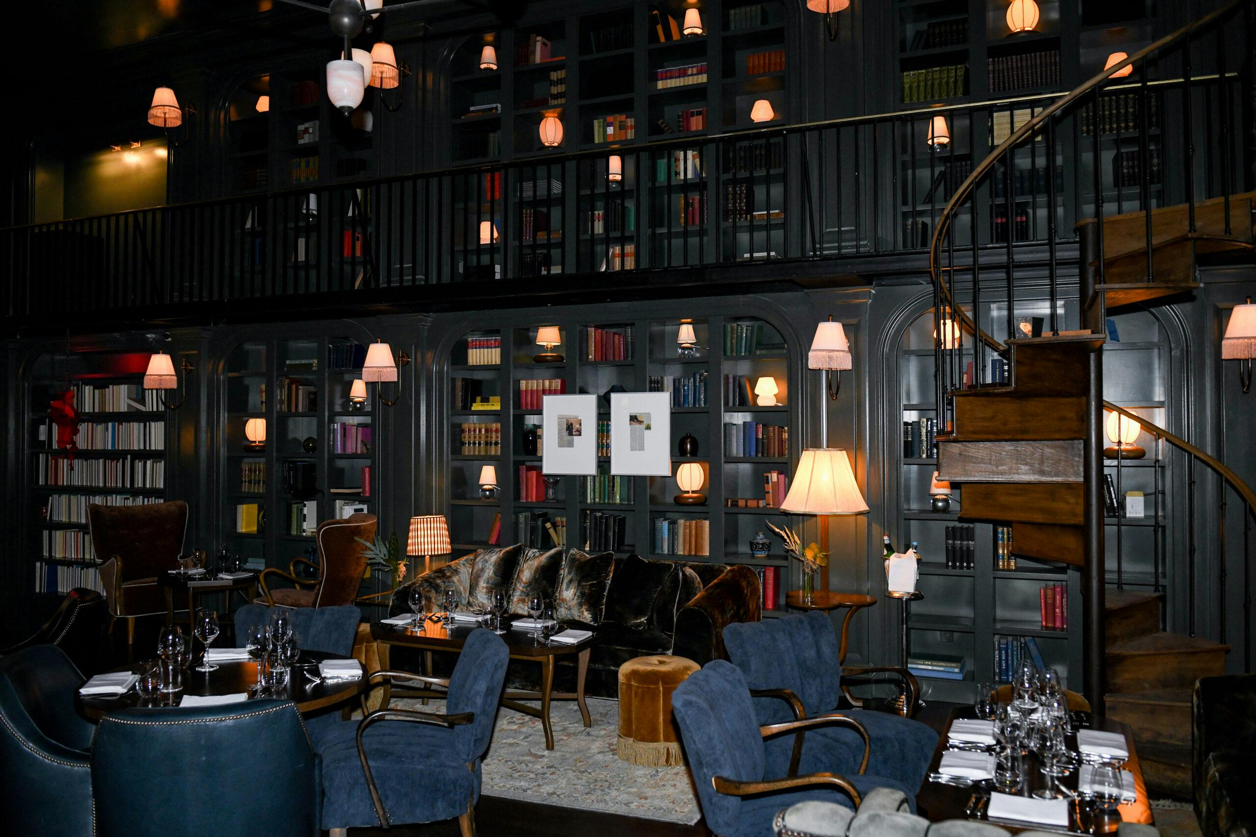 Elegant Atrium at The Ned, warm lighting, ideal for upscale events and intimate gatherings.