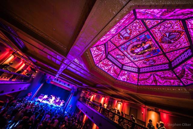 "White Eagle Hall Jersey City vibrant event space with ornate ceiling, ideal for performances."