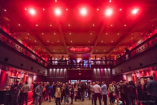 White Eagle Hall event space with red lighting, ideal for receptions and gatherings.