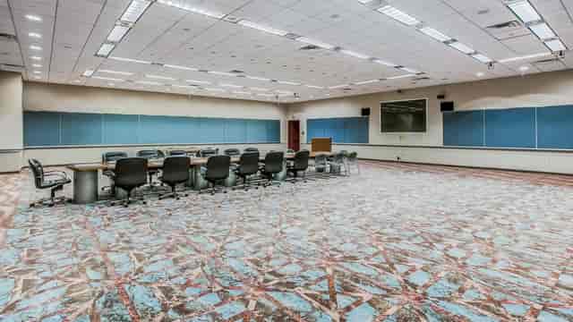 Spacious Atlantic City Convention Center meeting room with large conference table for events.