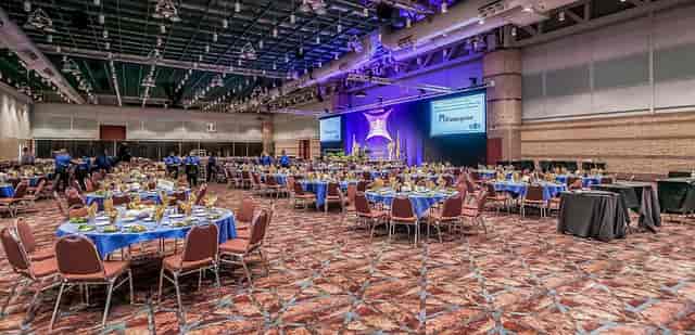 Atlantic City Convention Center exhibit hall with elegant round tables for formal events.